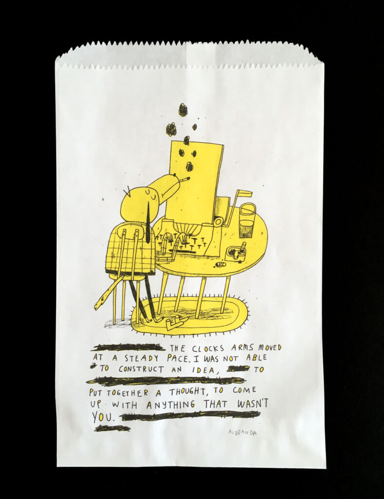 A white paper bag with a black and yellow illustration of an anthropomorphized dog typing on a typewriter smoking a cigarette, above black text.  