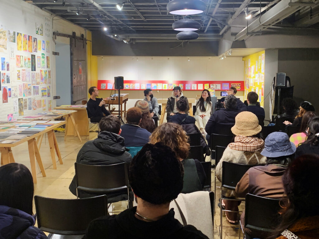 Photo of a panel discussion with Caroline Paquita-Kern, Robert Blair, Jinhee Han, Aidan Fitzgerald, and Kelli Anderson moderated by Panayiotis Terzis in the Printing the Future exhibition space.