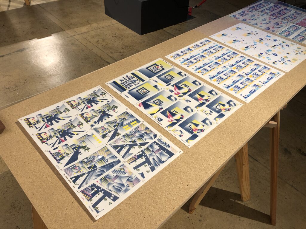 Photograph of Printing the Future Exhibition, riso prints are arranged on wooden tables.