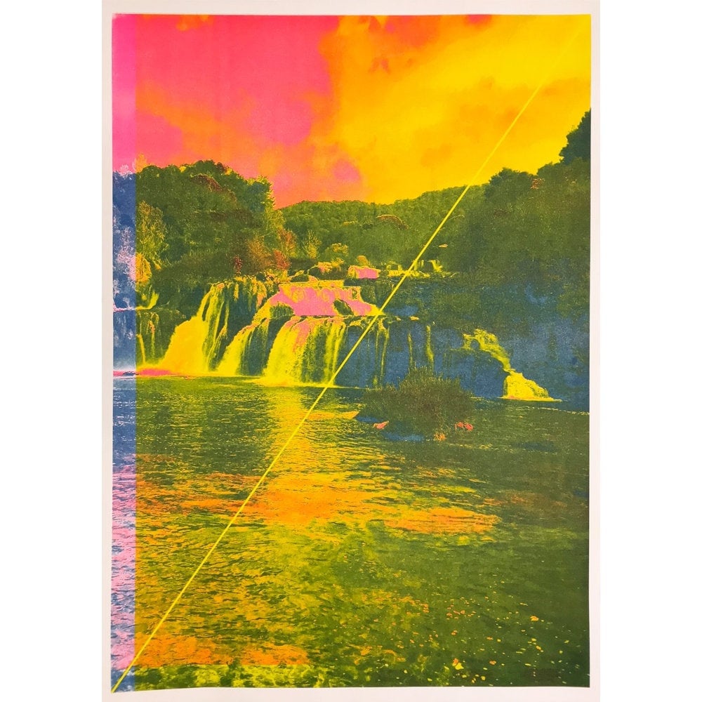 Brightly saturated CMY photograph of a forest, cliff and waterfall flowing into a larger body of water with a single thin yellow diagonal line running through it.