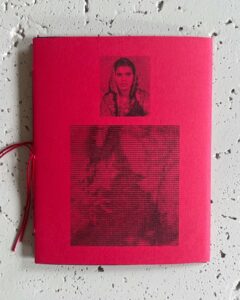 Back cover of Sarah Hakani Zarina's publication, bound in red paper with red thread, two images printed in black; a grainy photograph of a woman wearing a scarf over her head, and another abstracted image.