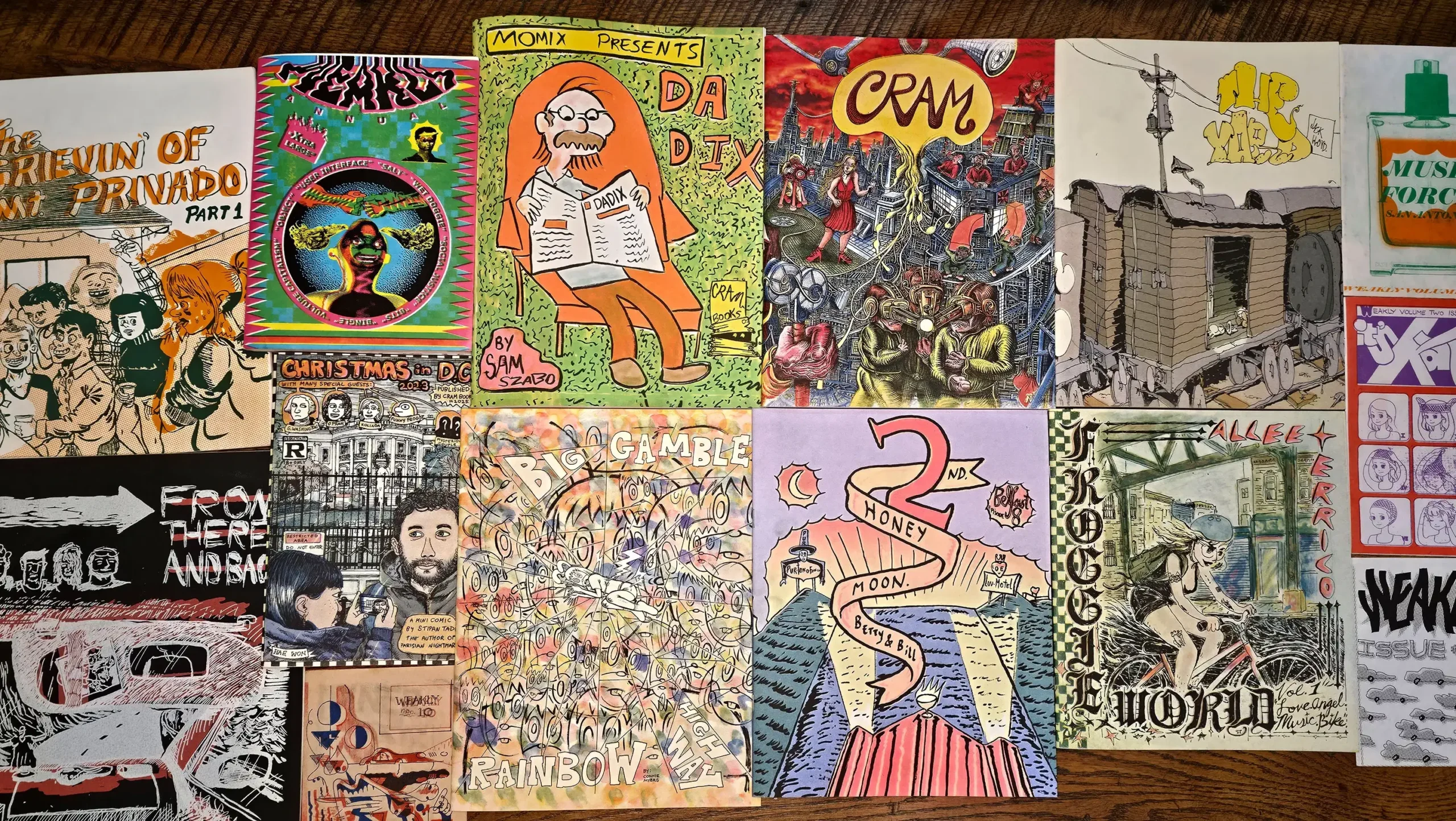 An array of colorful comics with wild graphics arranged on a tabletop
